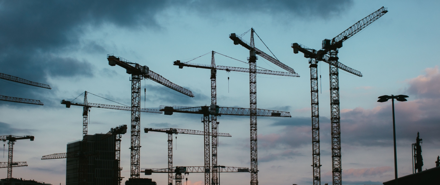Sky with construction cranes
